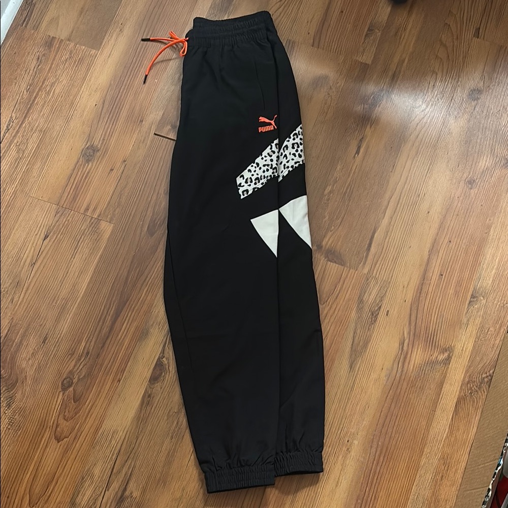 PUMA Women's Sportswear Tailored For Sports Woven Track Pants
